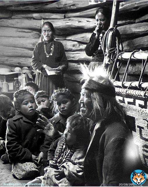 Seated close to the evening fire, 91-year old Navajo man, Gray Mountain, tells small children legends about the early days of the Navajo people. 1948. Photographed by, Leonard James McCombe, Photojournalist. (born June 1st, 1923, on the Isle of Man, and who passed away in 2015.)