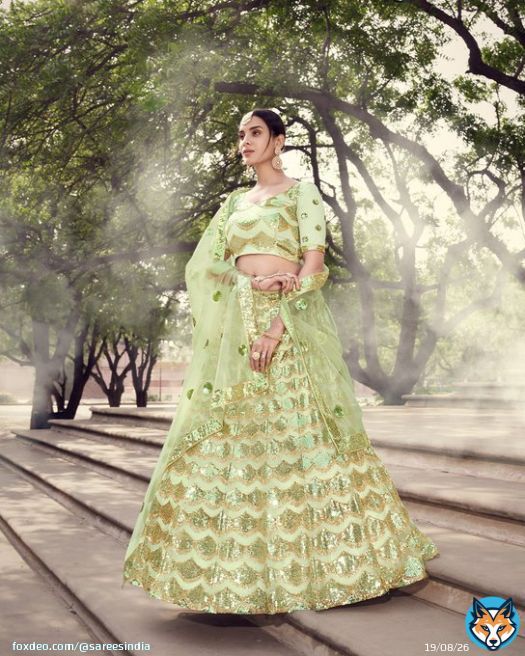 Net Bridal Lehenga in Green with Sequence work  Price: US$ 123.75  Product Code: 1696398 . . . . #indianweddingsaree #ethnicwear #traditionaldress #bollywood #womenfashion #indiandress #style #fashion  #weddingdress #bridal #heavydress #festivewears #lehenga