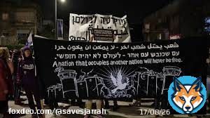 A black sign depicts the separation barrier, guard towers and barbed wire that contain the West Bank; in the middle, a dove bearing an olive branch. &ldquo;A nation that occupies another nation will never be free,&rdquo; says the sign in Arabic, Hebrew and English. #IsraeliApartheid