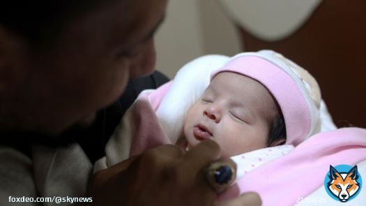'Miracle baby' born in quake rubble is adopted by her aunt and uncle - and given a new name