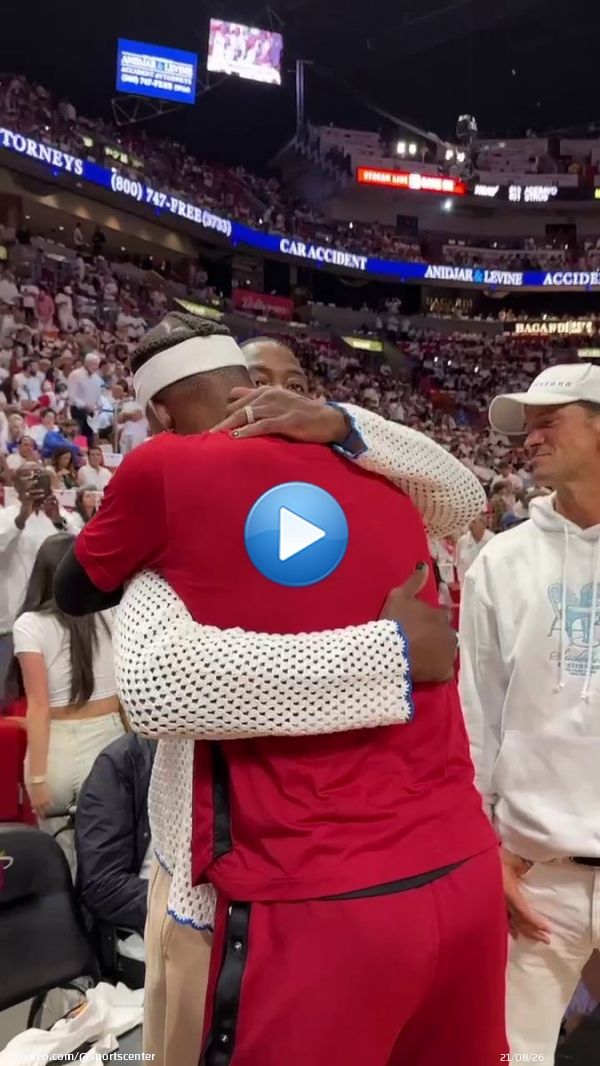 Dwyane Wade and Jimmy Butler hug before Game 3