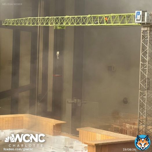 A chilling photo from WCNC viewer Melissa Weber shows a man standing on top of a crane waiting to be rescued as Charlotte firefighters battle a massive 5-alarm fire near SouthPark Mall.   Read more: