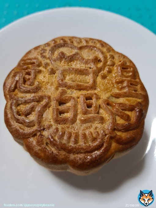 Chinese celebrates the 15th day of the 8th lunar month too. We call it 中秋節 (Mid-Autumn Festival). When I was young, my parents would take us to the local playground and we'd hold paper lanterns and enjoy the full moon.  This is 月餅 (moon cake), a deliicacy for the festival.