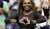 Serena Williams beat Montenegro's Danka Kovinic (6-3, 6-3) in the US Open's first-round on Monday night  Curiously, Bill Clinton was seen seated next to sex therapist and talk show host, Dr. Ruth&nbsp;Westheimer  People hold up signs reading 'We love
