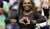 Serena Williams beat Montenegro's Danka Kovinic (6-3, 6-3) in the US Open's first-round on Monday night  Curiously, Bill Clinton was seen seated next to sex therapist and talk show host, Dr. Ruth&nbsp;Westheimer  People hold up signs reading 'We love