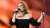 Adele used some colorful language to warn her audience not to throw things.