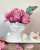 Photo by Derouich Fadwa on January 30, 2024. May be an image of vase, candle, flower arrangement, bust, rose and text.