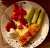 Grilled salmon in olive oil. Some salad veggies and sauce.