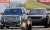 Todd Chrisley hides his face with a pillow as he and wife Julie report to federal prisons 650 miles apart to begin their combined 19-year sentences for tax evasion and fraud.