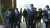 サッカーワールドカップ、カタール大会を終え、7日に帰国した森保監督と選手たちが、8日、総理大臣官邸を訪れ、岸田総理大臣と面会しました。 面会のあと、記者団の取材に答える前のひとコマです。堂安選手に歩み寄ったのは&hellip;。    #nhk_video