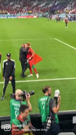 Morocco's Abdelhamid Sabiri celebrates with the Palestinian flag after reaching the semi-final of the World Cup
