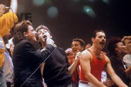 Bono, Paul McCartney, and Freddie Mercury at Live Aid, 1985. Photo by PA Images via Getty Images