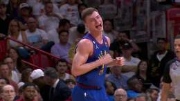 Christian Braun with the TOUGH bucket over Jimmy Butler