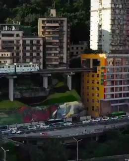 A train that runs through residential apartments in China.