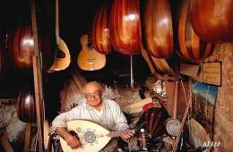 Beirut in 1970. A craft master of musical string instruments, notably the oriental Oud, playing with his Oud in his atelier. Photo George F. Mobley  National Geographic  Al Izziddin
