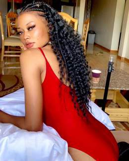 Photo by Kimlondon in Kampala, Uganda. May be an image of 1 person, braids, long hair and slip.