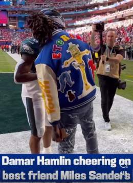 In an act of overt mockery, the guy pretending to be Damar Hamlin is wearing a jacket that says &ldquo;eternal&rdquo; in rainbow colored letters and has a satanic skull-faced Jesus being crucified with what appears to be his loincloth holding a hand 